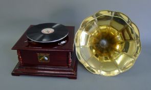 A gramophone and horn. 37 cm wide.