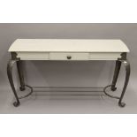 A single drawer side table with white painted top and metal base. 125 cm wide.