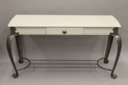 A single drawer side table with white painted top and metal base. 125 cm wide.