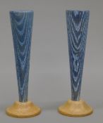 A pair of oak candlesticks, by repute made from wood from Ely Cathedral. 21 cm high.