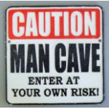 A cast iron Man Cave sign. 24.5 cm square.