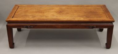 A Chinese hardwood low table. 127 cm long.