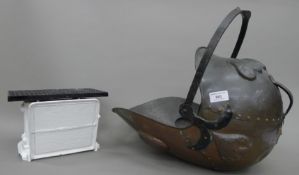 A copper coal scuttle and a set of scales.