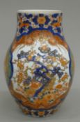 A 19th century Japanese Imari porcelain vase. 24.5 cm high.