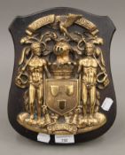 A bronze coat of arms for the Earl of Erroll, mounted on an oak shield. 27.5 cm high.