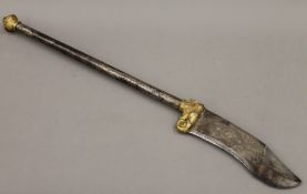 An antique Eastern dagger with elephant mask mount. 71 cm long.