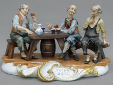 A Capodimonte type group, The Card Players. 39 cm wide.