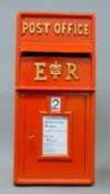 A red post box. 65 cm high.