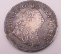 A George III 1811 3 shill bank token. 3.5 cm diameter.