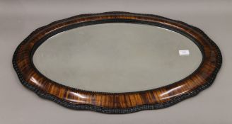 An early 20th century bevelled mirror. 55 x 83 cm.