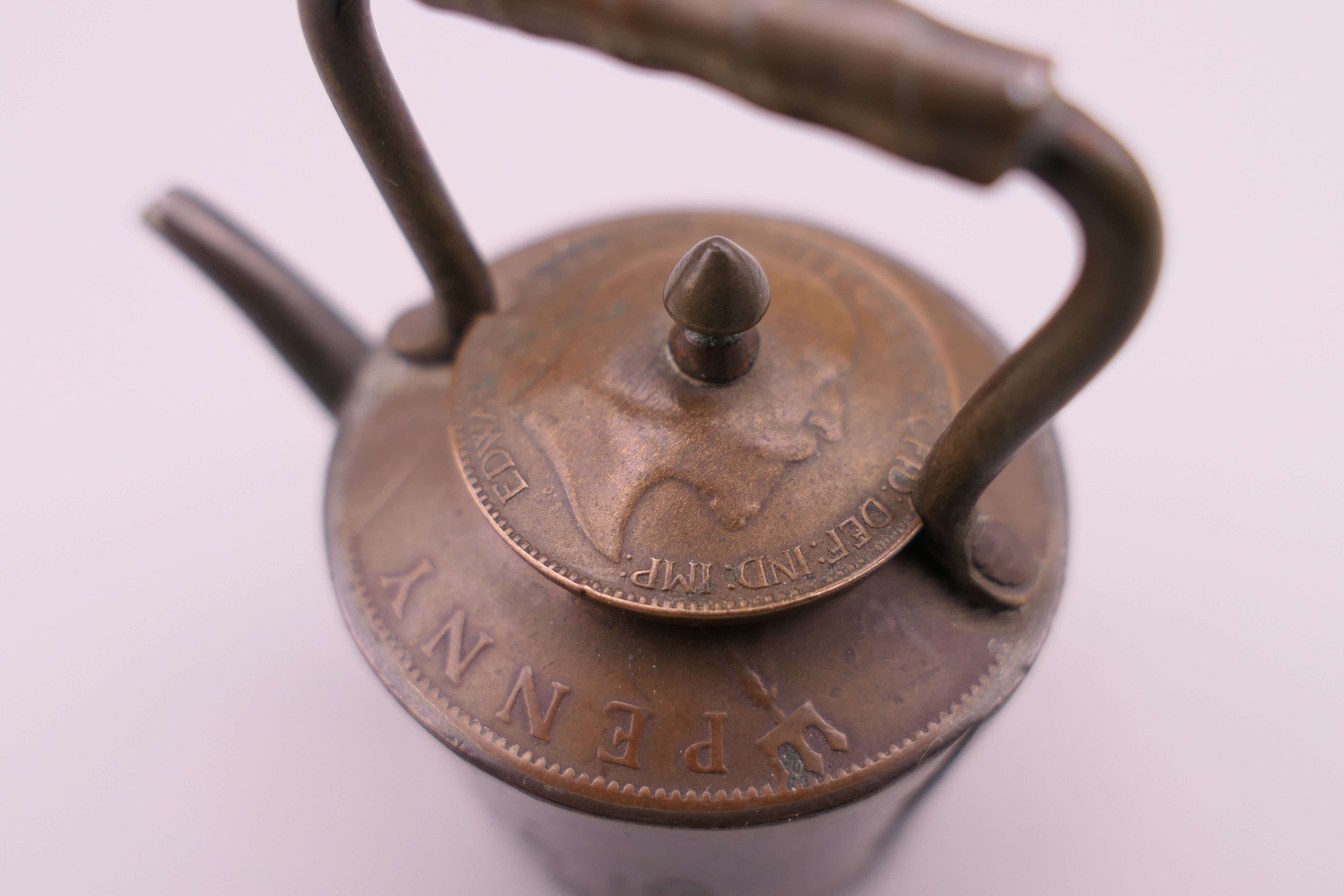A doll's house copper kettle, made from old copper coins. 5 cm high. - Image 4 of 4