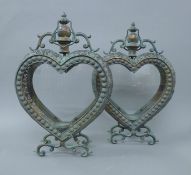 A pair of copper heart formed lanterns. 52 cm high.