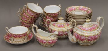 A 19th century porcelain tea set decorated with roses.