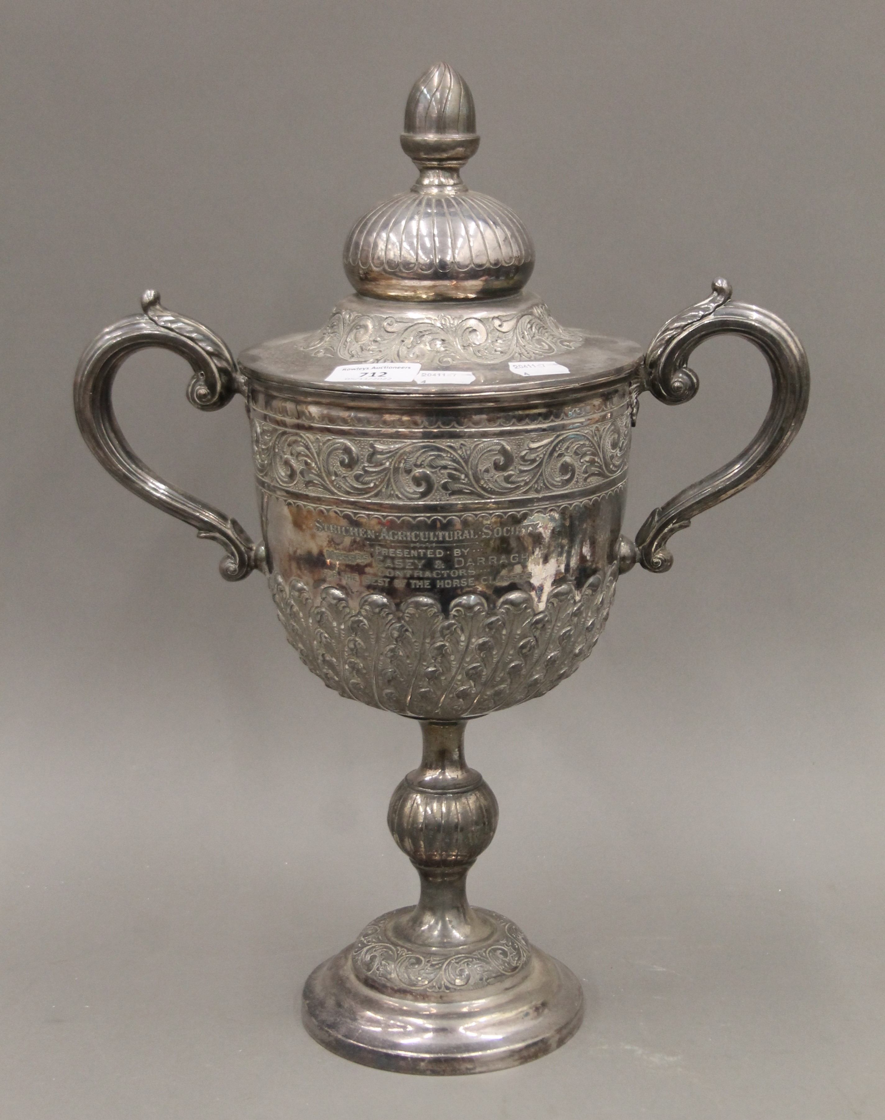 A silver plated lidded trophy cup. 45 cm high.