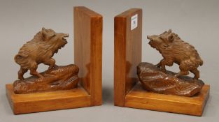 A pair of carved wooden bookends formed as wild boar. 14.5 cm high.