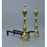 A pair of brass andirons. 46 cm high.