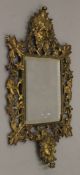 A brass framed mirror. 43 cm high.