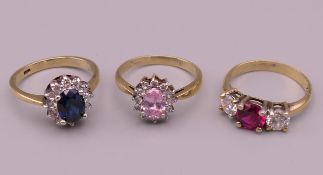 Three 18 ct gold dress rings. 9.3 grammes total weight.