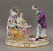 A large Continental porcelain figural group. 28 cm high.