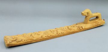 A Norwegian carved pine mangle board. 73 cm long.