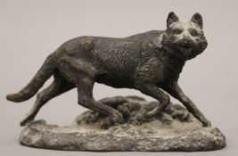 A patinated bronze model of a fox. 10.5 cm long.