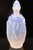 A French glass scent bottle depicting female nudes, indistinctly marked to base. 9.5 cm high.