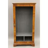 A walnut side cabinet. 74.5 cm wide.