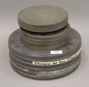 A quantity of vintage film reels and tins