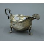 A silver sauce boat. 18 cm long. 242.3 grammes.