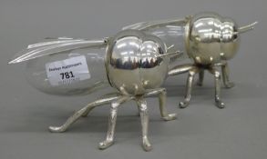 A pair of glass and silver plate bee shaped preserve pots. 15.5 cm long.