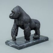 A bronze model of a gorilla. 17 cm high.