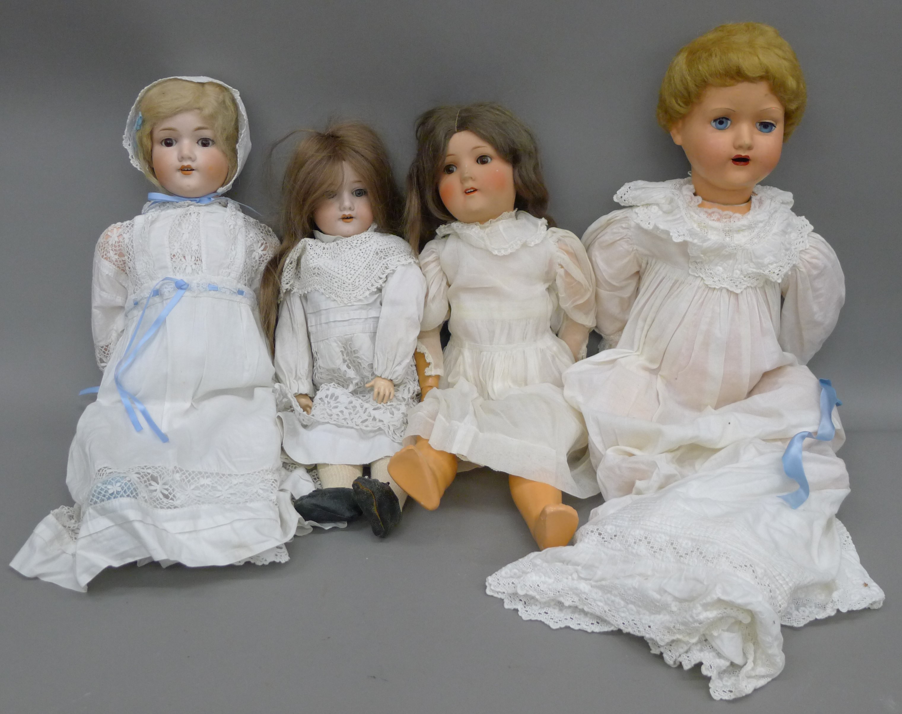 Three 19th century bisque headed dolls and a later doll.