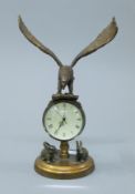 A bronze eagle ball clock. 21.5 cm high.