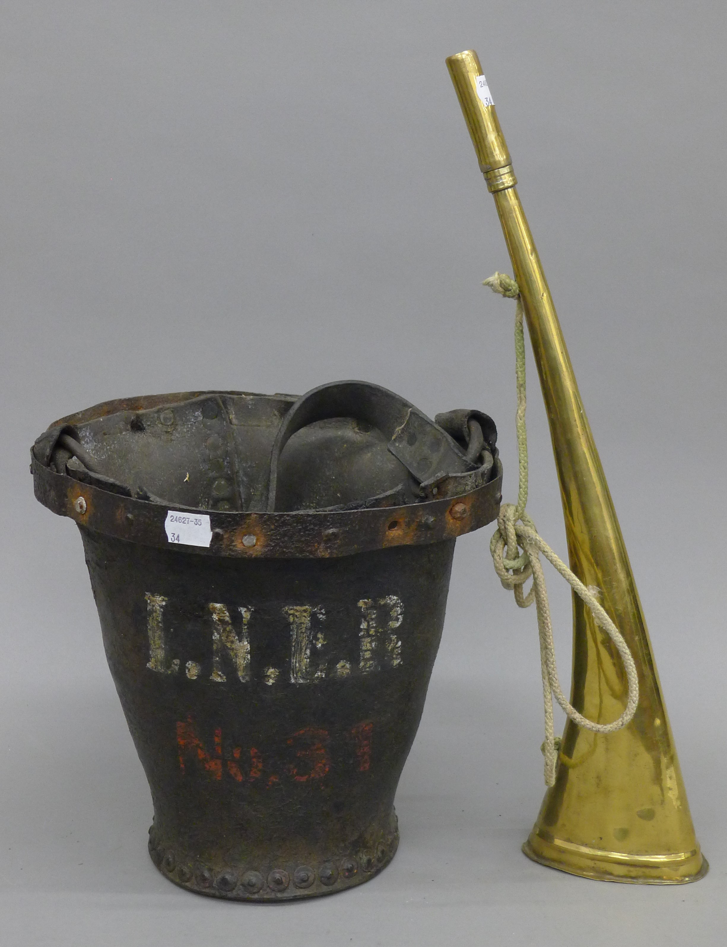 An old leather bucket, marked LNER with railway brass horn. The former 24 cm high.