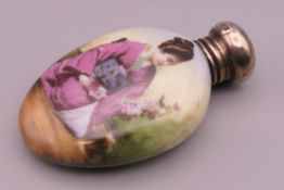 A Victorian silver topped porcelain scent bottle. 6 cm high.