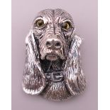 A silver dog form brooch. 3.5 cm high.