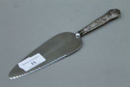 A silver handled cake knife.