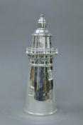 A silver plated cocktail shaker formed as a lighthouse. 34 cm high.