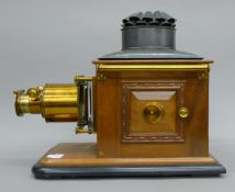 A Victorian magic lantern projector. 52 cm long.