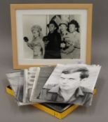 A framed photograph of The Carry On crew, a quantity of photographs pertaining to John Taylor, etc.