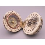 A bone globe compass. 4 cm diameter.