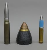 A Harrier 30mm practice round, an A.10 tank buster practice shell and a WWI shell head.