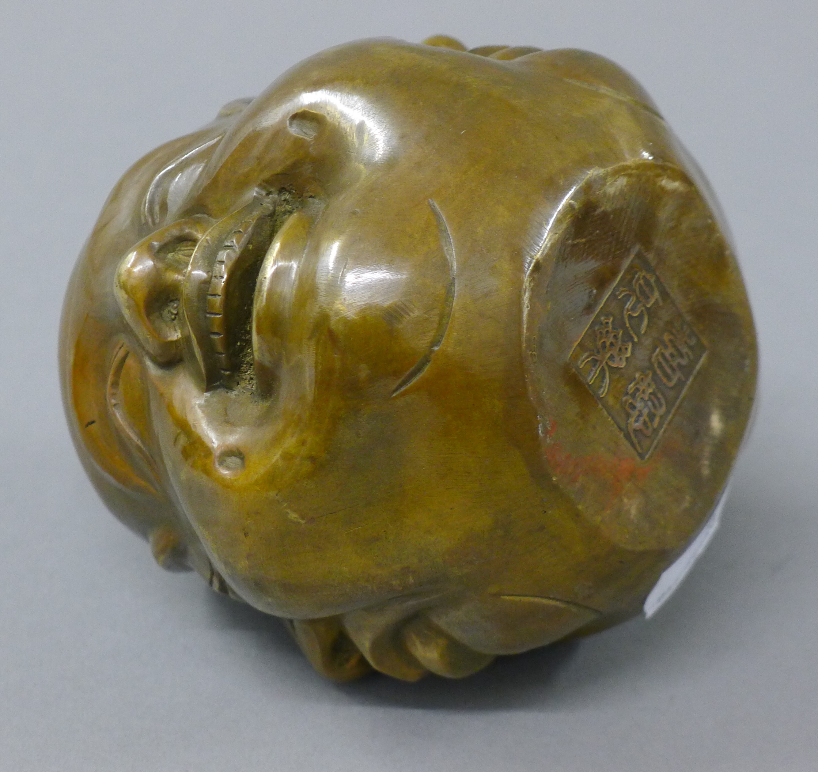 A brass four faced buddha head. 10.5 cm high. - Image 3 of 4