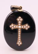 A Victorian seed pearl mounted mourning pendant. 6 cm high including suspension loop.