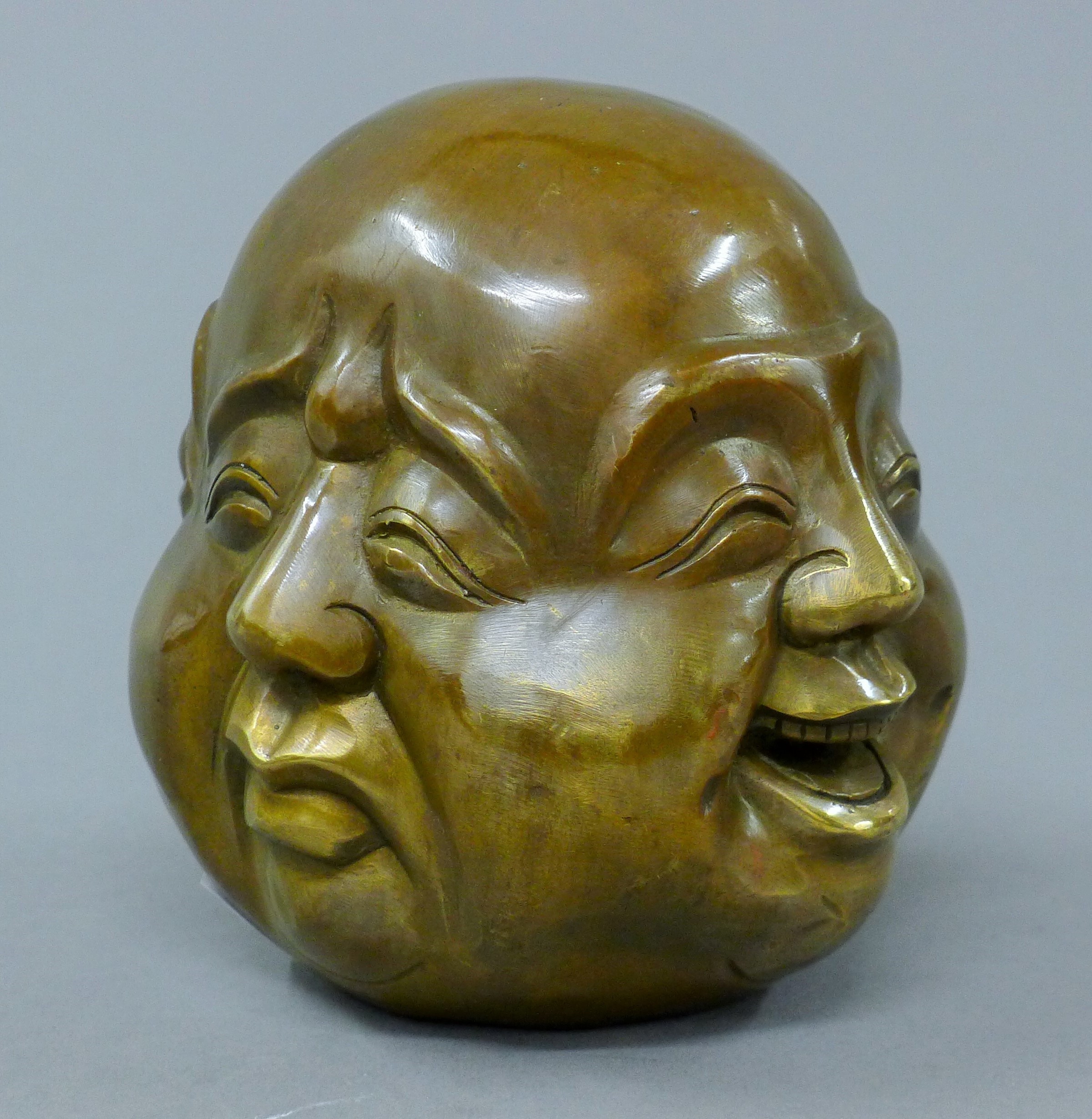 A brass four faced buddha head. 10.5 cm high. - Image 2 of 4