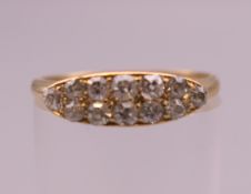 An 18 ct gold and diamond navette ring. Ring size P. 2 grammes total weight.