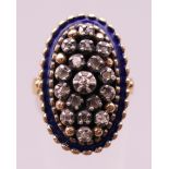 An antique 18 ct gold enamel and diamond ring. Ring size M.