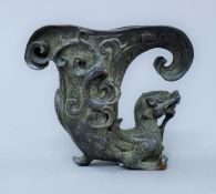 A Chinese bronze fo dog libation cup.