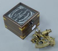 A boxed model of a sextant. The box 11 cm wide.