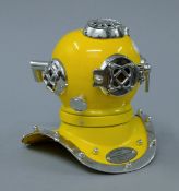 A miniature yellow diver's helmet. 18 cm high.